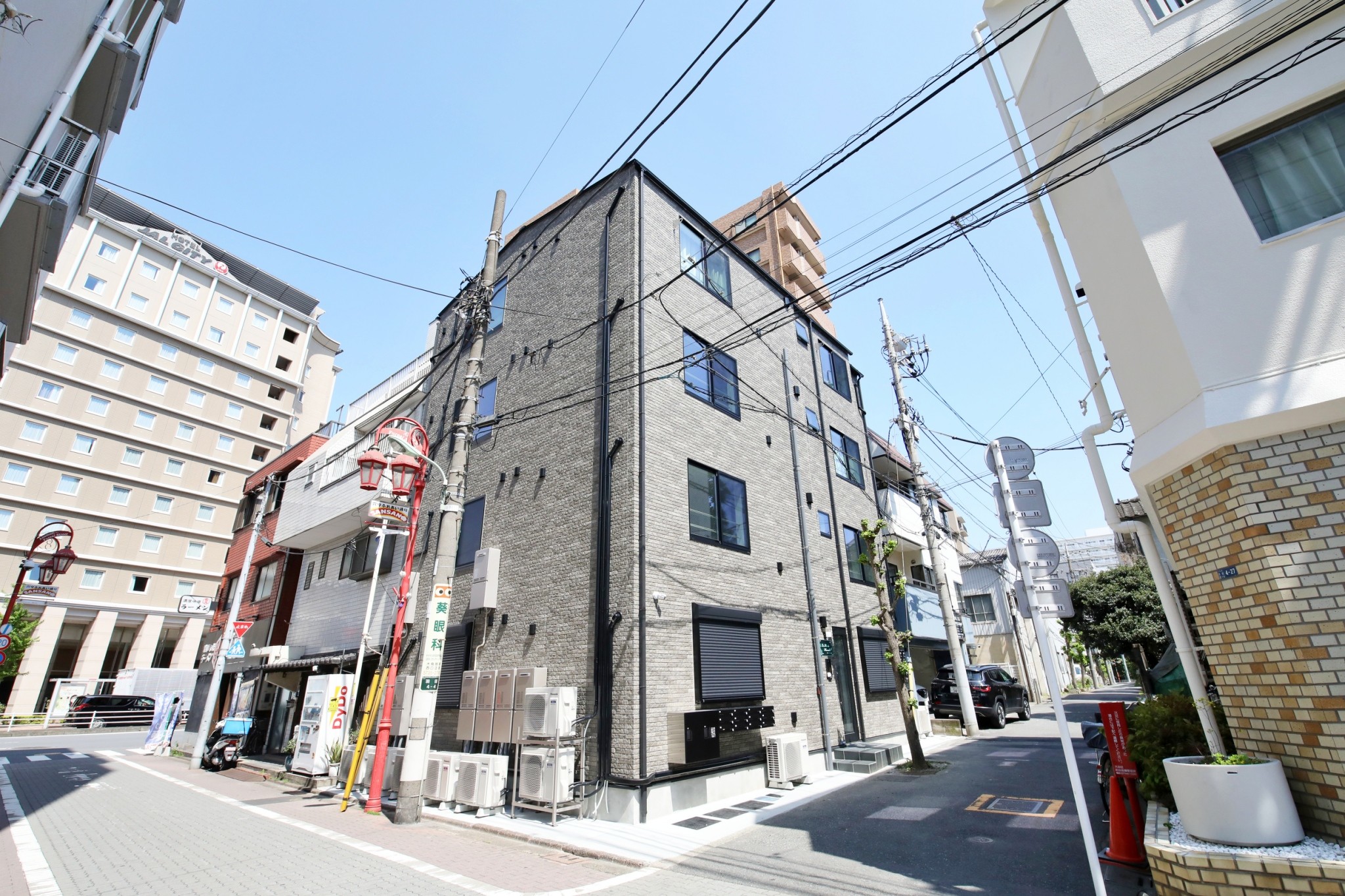 Stark House Tokyo Haneda – grey brick building exterior