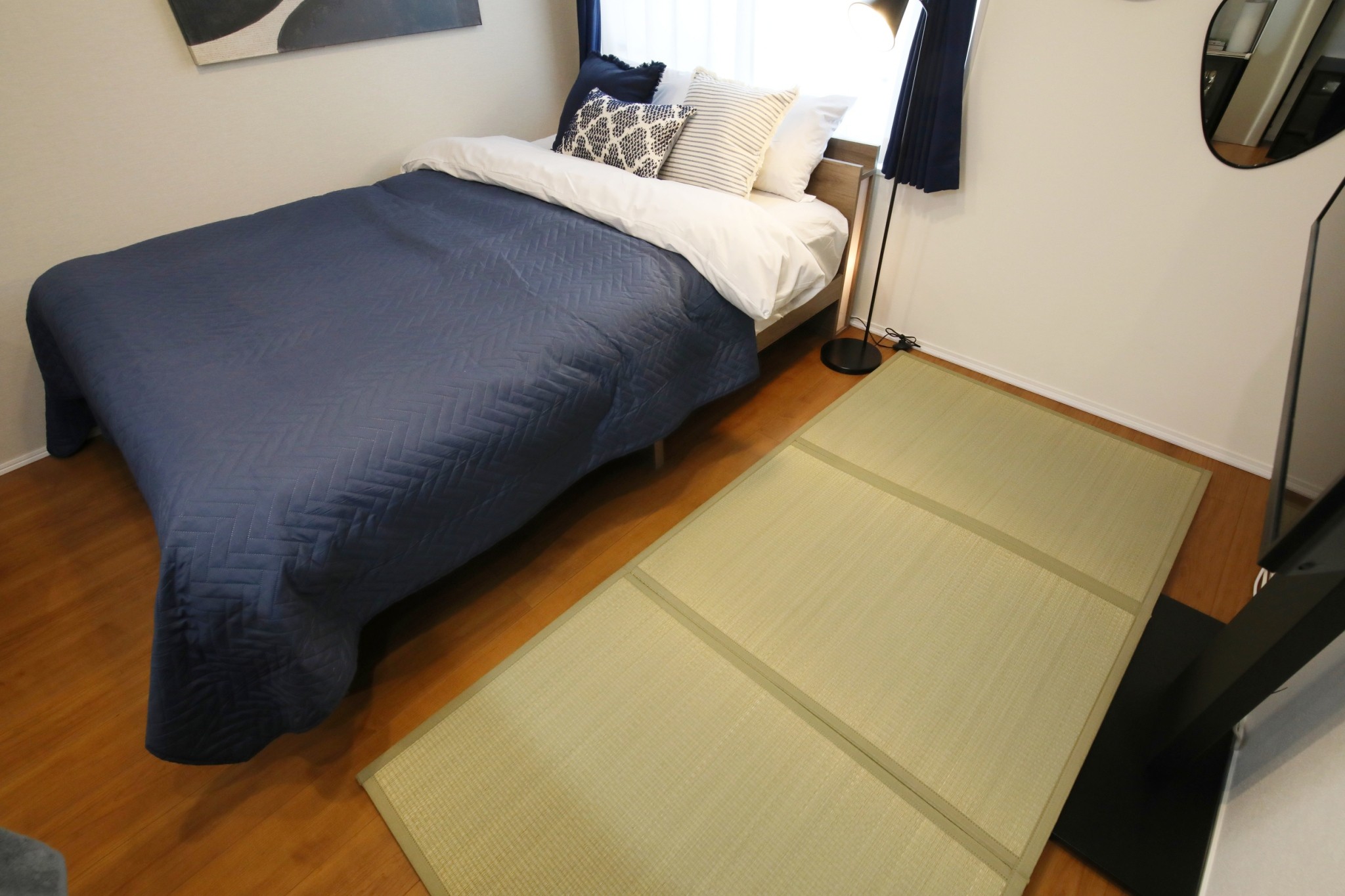 Room 202 double bed with tatami mat flooring