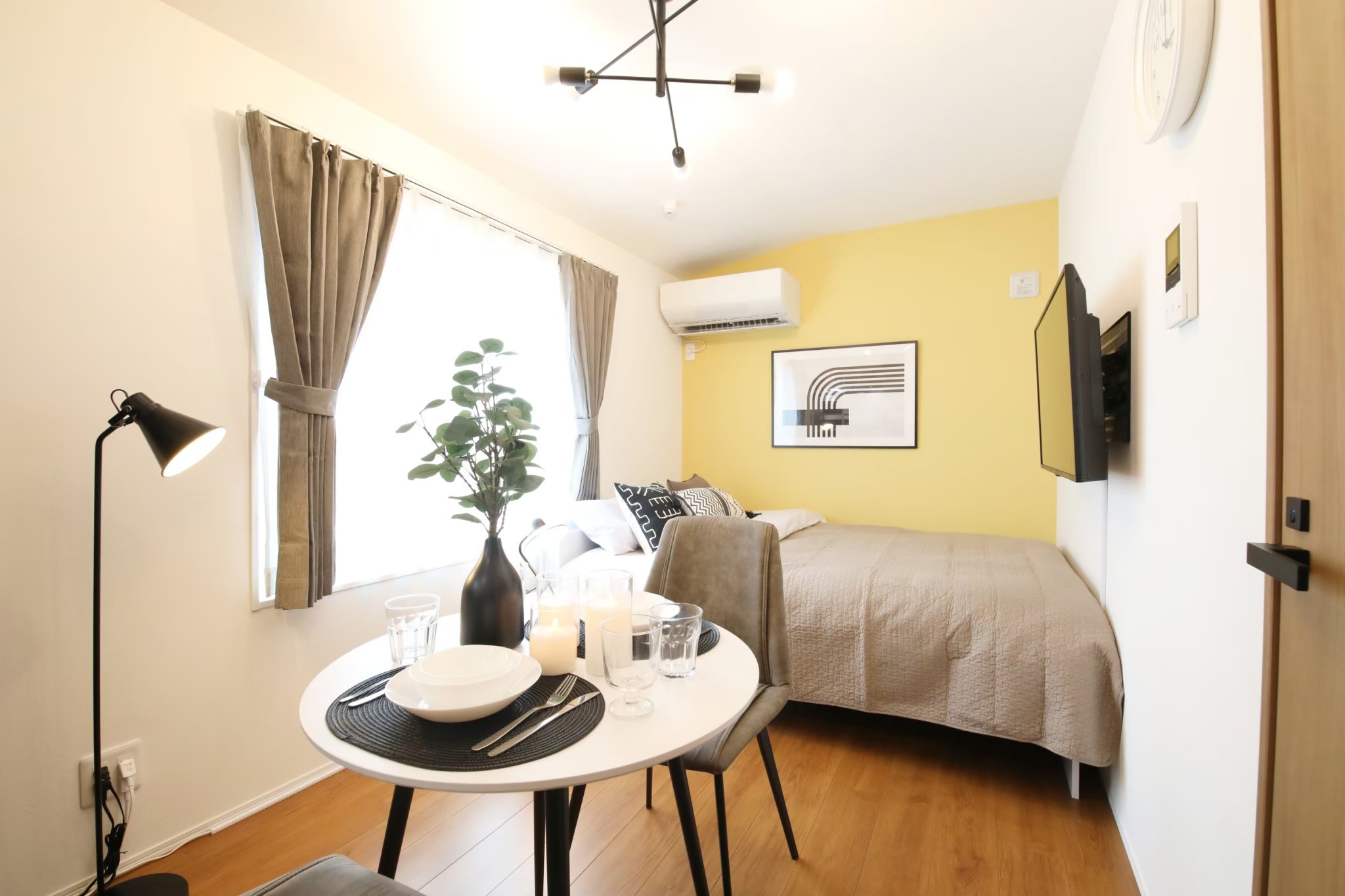 Stark House Tokyo Haneda Room 401 studio with yellow accent wall