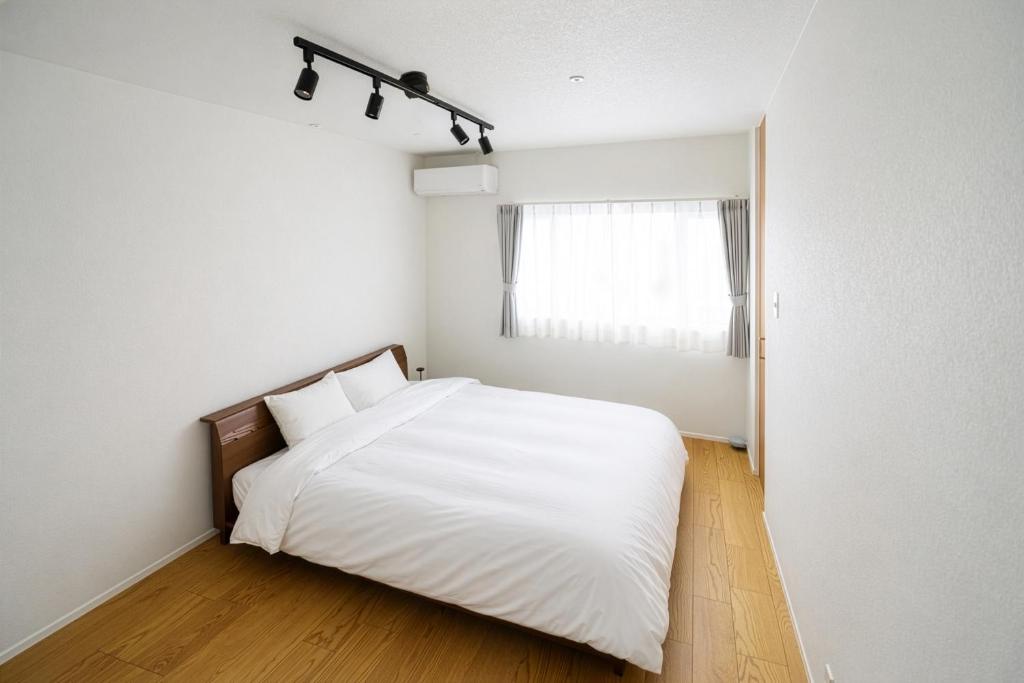 Master bedroom with double bed and wooden headboard