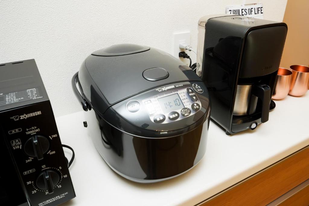 Kitchen with Zojirushi rice cooker and coffee maker