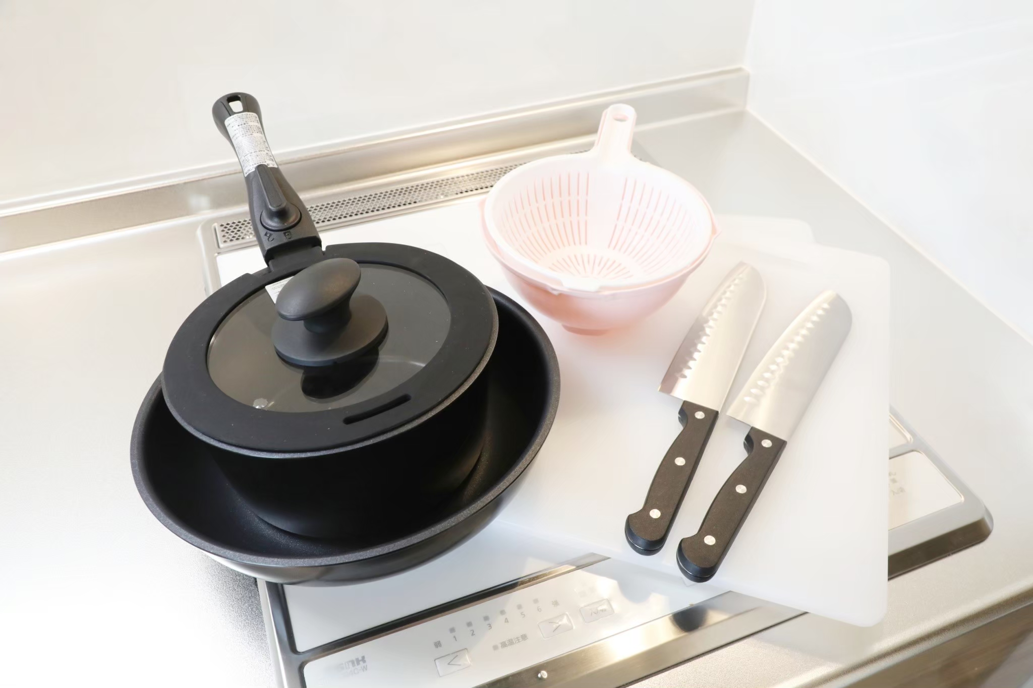 Room 103 cookware — pan, knives and cutting board
